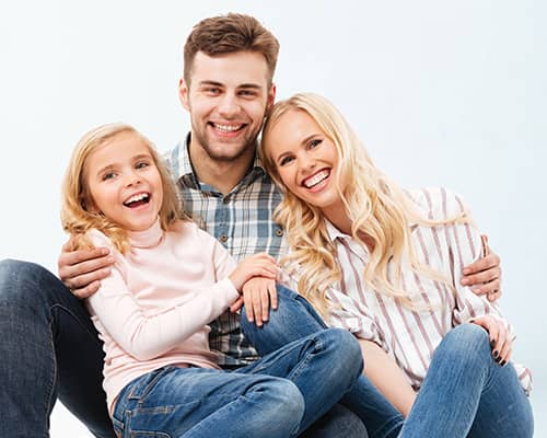 Cheerful Family From Texas Sitting Together After Home Purchase